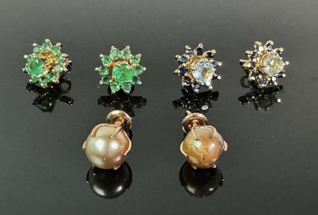 Three Pair 14K Gold Gemstone Earrings (6pc): Three Pair of 14K Gold Gemstone Earrings: (1) Pair 14K Gold stud earrings set with emeralds, (1) Pair 14K gold stud earrings set with aquamarine stone with sapphire surround, (1) Pair 14K gold stud ea