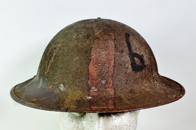 WW1 U.S. Combat Helmet, Painted 76th Division: World War One U.S. Combat Helmet with Painted "76" (76th Division). Steel helmet with rough combat finish and paint in red and black including stylized "7" and "6". good condition, without liner, part