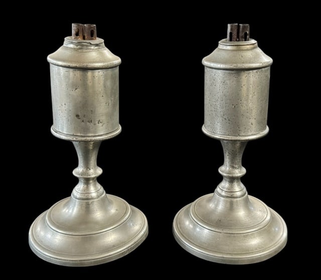 19th C. Pewter Whale Oil Lamps, Putnam (2pc): Pair of 19th C. Massachusetts Pewter Whale Oil Lamps, Signed "PUTNAM" (James Putnam b. 1829, Malden, Massachusetts). Columnar form with double flues. Good condition with wear, measure: 6.5" H