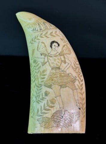 Antique Scrimshaw Sperm Whale Tooth, Cupid 6": Large Antique Scrimshaw Sperm Whale Tooth. Polychrome decoration of a winged figure of Cupid with bow and arrow, surmounted by a three-masted sailing ship amidst foliate decoration. Excellent conditio