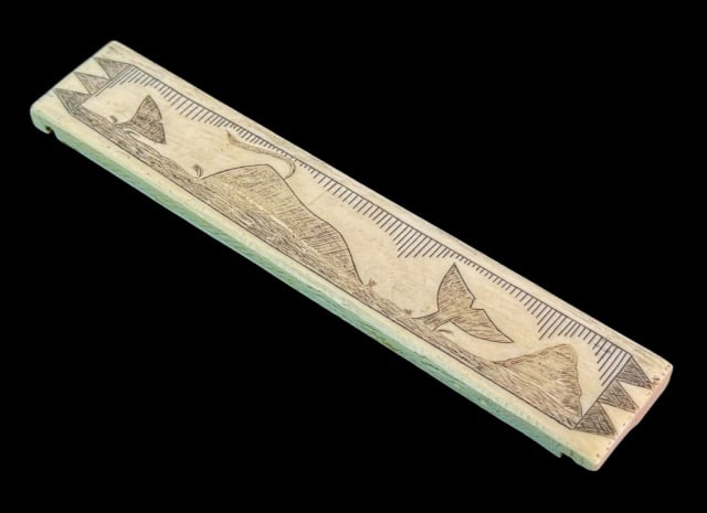 Antique Scrimshaw Whale Bone Toothpick Holder: Antique Scrimshaw Whale Bone Toothpick Holder. Obverse decorated with whales at sea. Slotted reverse with four holes at top edge. Good condition, measures: 4.5" H x 6" W.