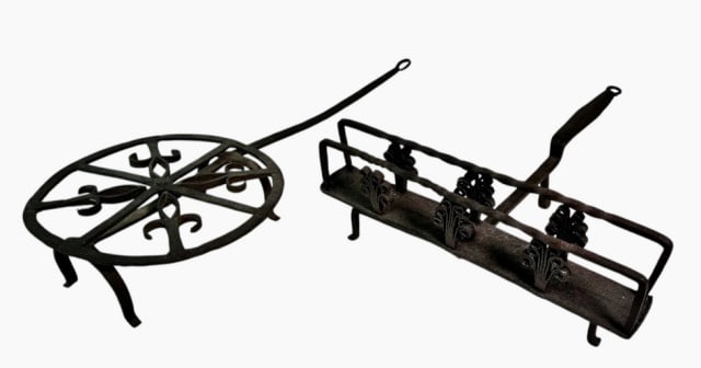 18th C Wrought Iron Fireplace Toasters (2pc): Two 18th C. Wrought Iron Fireplace Toasters: (1) Toaster with four footed base with iron pinned wheel top with decorative fleur de lis and rattail handle, (1) Three- footed box form toaster with iron
