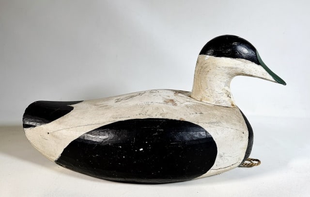 Antique New England Wooden Eider Duck Decoy: Antique New England Hand Carved and Painted Wooden Eider Duck Decoy. Elegant carved decoy, base with rigging loop and hemp cord. Good condition with wear, measures: 8.5" H x 16" L
