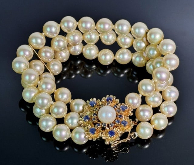 Saltwater Cultured Pearl Bracelet, 14K Gold Clasp: Saltwater Cultured Pearl Bracelet with 14K Gold and Sapphire Clasp. Three strands of fifty-four high quality saltwater cultured pearls with decorative 14K yellow gold clasp set with nineteen small rou