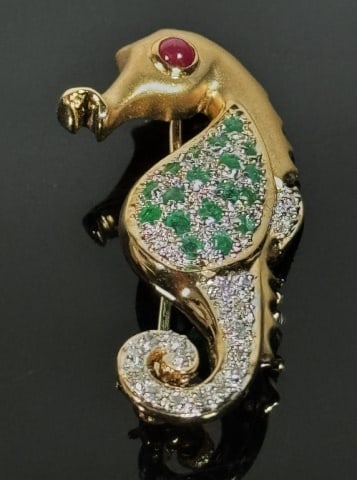 14K Gold Pave Diamond, Emerald Seahorse Pin: 14K Gold Pave Diamond and Emerald Seahorse Pin. Crafted of 14K yellow gold, set with small round cut diamonds and emeralds. Good condition, measures: 2.5" L , Weight: 3.4 dwts.