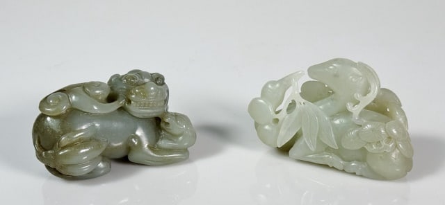 Antique Chinese Qing Carved Jade (2pc): Two Antique Chinese Q'ing Period Jade Figure: (1) Carved pale green jade crouched Bixie, (1) Carved green jade figure of a seated deer with foliate mask. Good condition, larger measures: 3" L.
