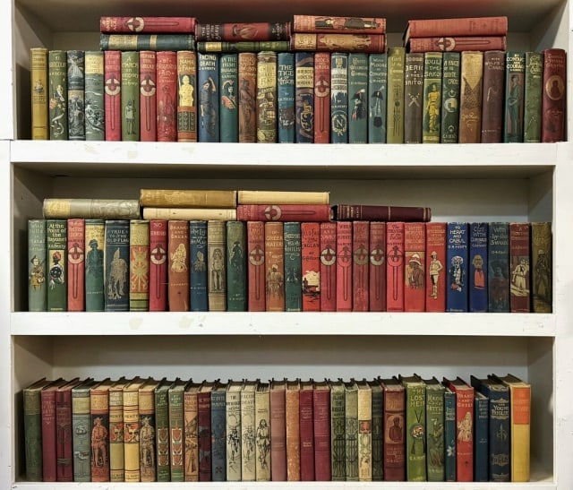 Books, Collection, Works Of G.A. Henty (101pc): Collection of One Hundred One Books. The works of G.A. Henty. Most 8vo, with many early printings featuring original pictorial cloth and gilt titles, published by Blackie & Son of London and Charles S