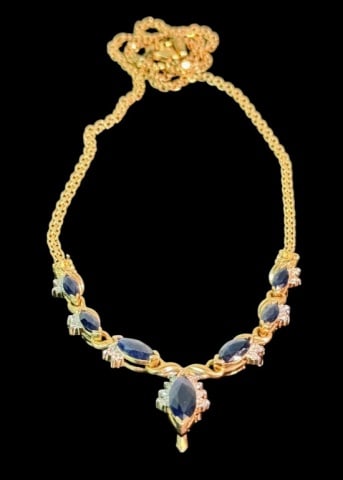 14K Gold, Diamond and Sapphire Necklace: 14K Gold Sapphire and Diamond Necklace. 14K yellow gold chain with pendant set with seven graduated marquise cut sapphire surmounted by small round cut diamonds. Good condition, measures 17" L, Total 