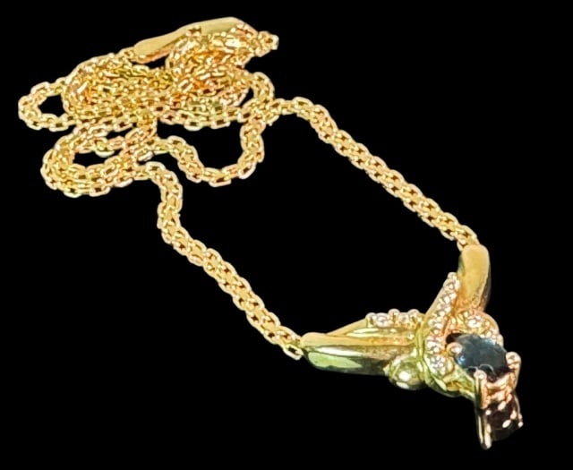 14K Gold, Diamond and Sapphire Necklace: 14K Gold Sapphire and Diamond Necklace. 14K yellow gold chain with pendant set with one pear cut sapphire surmounted by ten small round cut diamonds. Good condition, measures 15" L, Total assembled we