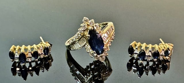 14K Gold and Sapphire, Ring, Earrings (3pc): 14K Gold Diamond and Sapphire Ring and Earrings: (1) 14K yellow gold ring set with good quality marquis cut sapphire center stone, flanked by twenty-two small round cut diamonds and sixteen small bagu