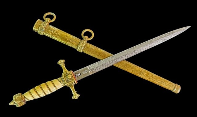 WW1 German Imperial Navy Officer Dagger WKC: World War One German German Imperial Navy Officer's Dirk, W.K.C Knights Head Logo. Double etched steel blade decorated with military and naval themes. Gilt brass figural cross guard and crown form pom