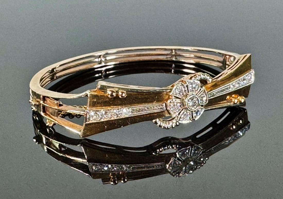 Antique 18K Gold, Diamond Art Deco Bracelet: 18K Gold and Diamond Art Deco Bracelet. Crafted of 18K yellow gold, center set with seven round cut diamonds of good quality, flanked by eight graduated round cut diamonds. Hinged body with keeper. Go