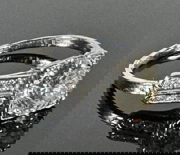 Antique .950 Platinum Diamond Ring 1.2 cts: Antique .950 Platinum and Diamond Ring. Crafted of .950 platinum set with center mine cut diamond evaluated as 1.2 cts, H-J color and SI1 clarity, flanked by 12 small round cut diamonds. Good conditio