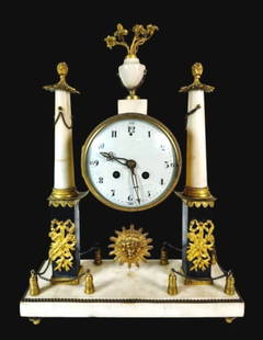19th C.  French Empire Mantel Clock: 19th C. French Empire Mantel Clock. Eight-day keywind time and strike movement with Arabic Numeral radial dial. Clock fixed between two stylized columns with decorative finial and gilt ormolu embellis