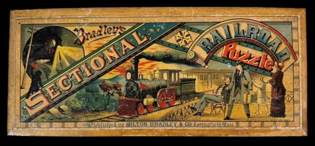 Milton Bradley "Sectional Railroad Puzzle" 1882: Antique "Sectional Railroad Puzzle" published by Milton Bradley & Co, Springfield, MA; patented May 30, 1882. Original wooden box with color lithograph cover contains 49 cardboard puzzle pieces, most