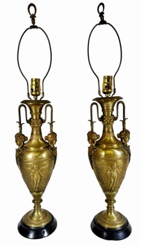 Antique French Bronze Neoclassical Lamps (2pc): Pair of Antique French Bronze Neoclassical Lamps. Gilt cast bronze in two handled urn form with stylized Medusa busts and putti decoration in relief. Good condition with wear, working condition,