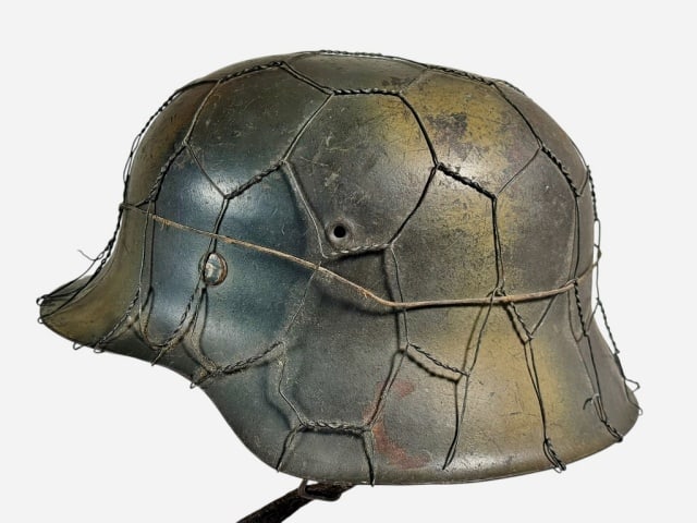 WW2 German M40 Helmet Normandy Pattern Camouflage: World War Two German Model 1942 Combat Helmet, Normandy Pattern Camouflage with Chicken Wire Basket. Larger sized steel Helmet with sprayed three color paint "Normandy Pattern" camouflage and chickenw