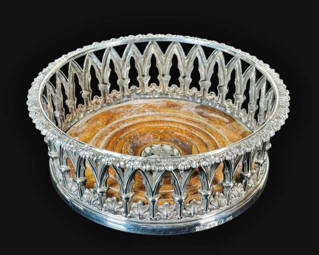 1835 William IV Sterling Silver Wine Coaster: English William IV Sterling Silver Wine Coaster. Gothic arch style reticulated body with turned wooden base with silver roundel at center. English hallmarks with 1835 date letter. Good condition with 