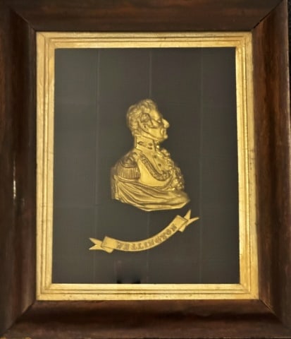 19th C English Gilt Bronze Memorial, Wellington: 19th C. Gilt Bronze Memorial, First Duke of Wellington, (Arthur Wellesley 1769-1852). Bust of Wellington in profile with military uniform and banner beneath memorializing his death in 1852. Panel in p