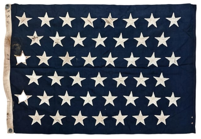 Spanish American War 45 Star Navy Ensign Flag: Antique Spanish American War Period U.S. Navy Ensign. Wool multi piece construction with hand applique linen "peekaboo" stars. Canvas hoist with "3XX" and faint New York maker stamped in ink. Fair