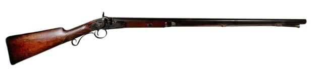 19th C New England Percussion Fowler Rifle: 19th C. New England Fowler Percussion Rifle. Carved wooden pinned half stock with steel barrel and wooden ramrod. Steel percussion action and scroll trigger guard. Fair condition, old oxidation,