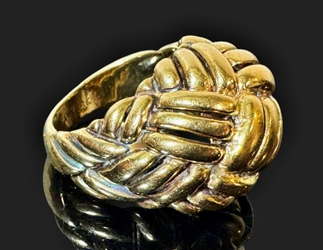 Vintage 18K Gold Knot Ring, Tiffany: Vintage 18K Gold Ring, Signed "TIFFANY". Crafted from 18K yellow gold, this ring consists of a wide band with a large woven knot design across the top. Ring Size: 6, weight: 9.8 dwt, 15.3 g.