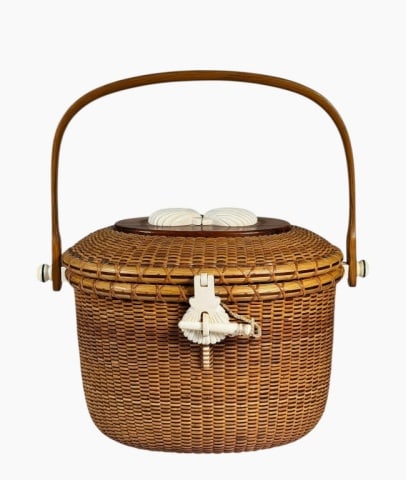 Hand Made Nantucket Friendship Basket: Hand Made Nantucket Friendship Basket. Traditional woven basket with two color cane, hinged lid and pinned bent wood swing handle, wooden base. Basket with decorative carved closure latch and pin and 