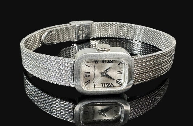 Antique 14K Gold Swiss Wristwatch, Lucian Picard: Antique 14K Gold Swiss Wristwatch, Signed "Lucien Picard". Watch with 14K white gold case with 17 jewel swiss movement, gold filled band. Watch in working condition, not running, measures 7.5" L.