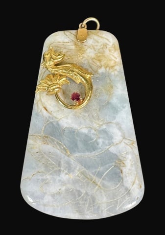14K Gold Carved Jadeite Pendant: 14K Gold Carved Jadeite Pendant. Multi-layered pendant carved of Jadeite with 14K yellow gold findings and decorated with a stylized 14K gold dragon holding a faceted gemstone. Jade with incised decor