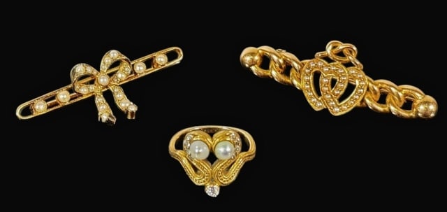 Three Antique 14K Gold Pins, Ring (3pc): Collection of Three 14K Gold and Seed Pearl Jewelry Pieces: (1) Pin crafted of 14K yellow gold with intertwined loops and hearts set with seed pearls, (1) Pin crafted of 14K yellow good with ribbon a 