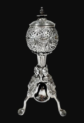 Antique Continental Silver Spice Box: Antique 19th Century Continental Silver "Besamim" Spice Box. Ornate silver repousse patterns and suspended bell, reticulated orb shaped top with a removable decorative finial. Tripod base with elevate
