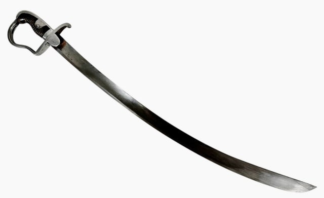 19th C German Blucher Blade Cavalry Sword: 19th C. German Blucher Blade Cavalry Sword, Signed "S & K" (Schnitzler & Kirschbaum) and Unit Marked. Heavy single fullered curved steel blade with steel stirrup hilt, langet unit marked "9.A.3.5", ri