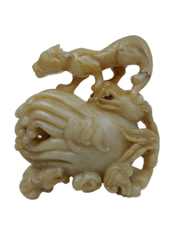 Jade Openwork Citron: Yellowish-grey standing openwork jade carving of a citron or Buddha's Hand surmounted by a female lion with a smaller lion crouched at base. A small bat is carved in bas-relief on surface of the fruit