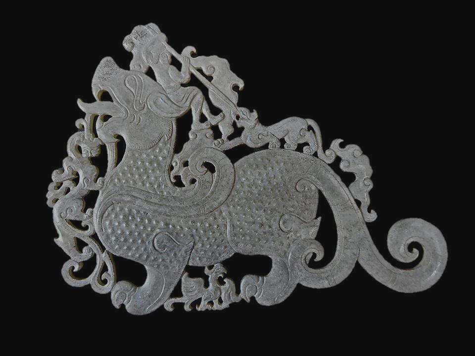 Jade Pi Yao Dragon Ornament: Openwork carved jade ornament featuring a celestial Pi Yao dragon with a small phoenix between his legs, surmounted by warrior fending off smaller dragons with a long spear. Incised details with well