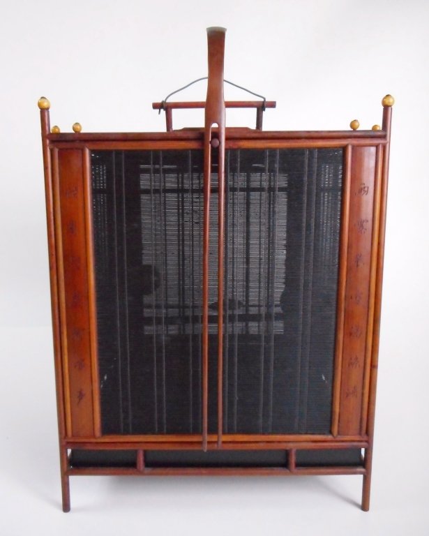 Antique Birdcage: Having detachable reed screen sides with Chinese characters on each side, secured by amber colored stone pins at top, two cloisonne feeders, two carved bone holders rendered as grape clusters, and one
