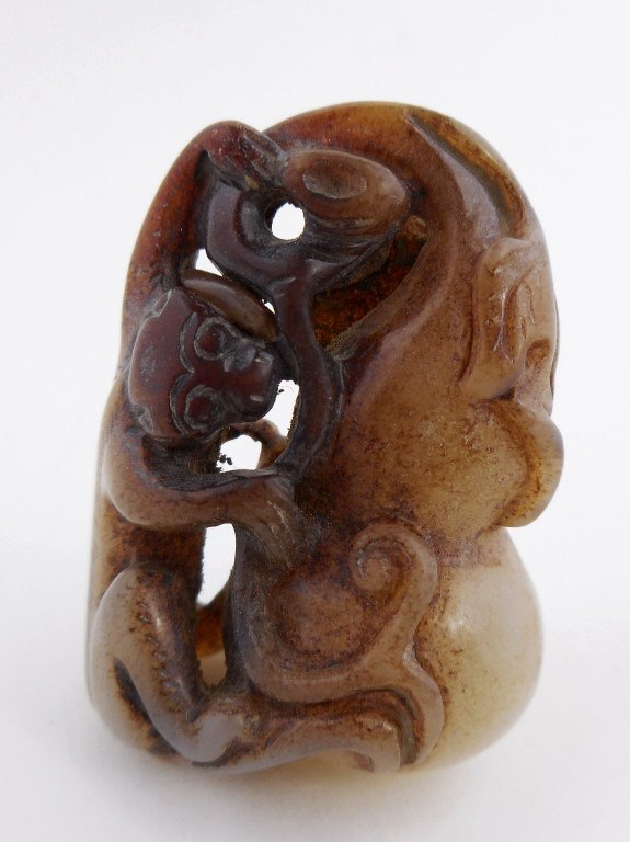 Jade Monkey Figure: Grey-white openwork carving of a monkey with a gourd. Incised details with well worn grooves. Deep brown and mahogany suffusion.1.75"H Likely Ming Dynasty (1368-1644), unearthed in Henan Province._x00