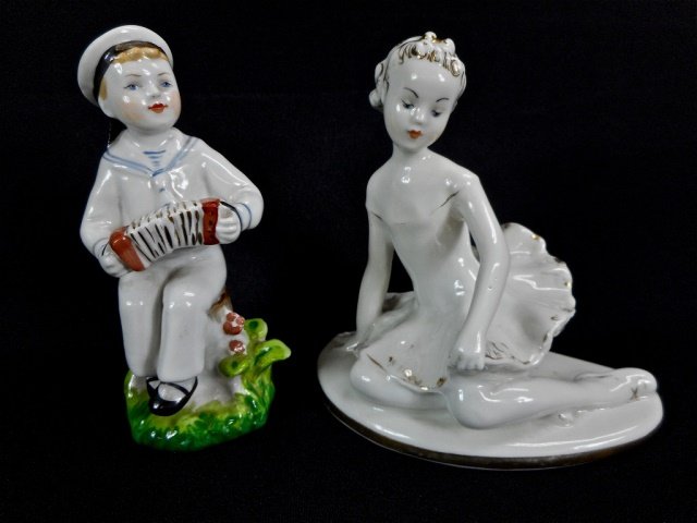 Two Vintage Lomonosov Figurines: Two vintage Lomonosov porcelain figurines. One in the form of a seated ballerina in white porcelain with gilt accents that exhibit some wear. Blue LFZ factory mark. Circa 1950-60's. 5"H. Together with