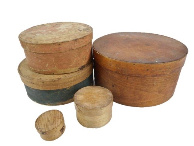Collection of Five Antique Pantry Boxes: Five wooden pantry boxes ranging in size from 2" in diameter to 8.5". Some retain original painted surfaces in green and salmon, with some paint loss and surface scratches.