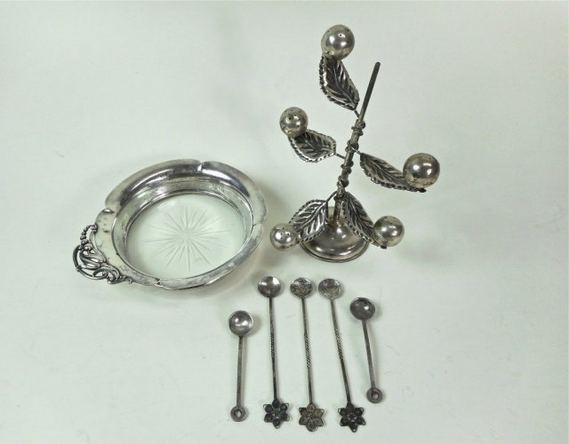Sterling and Coin Silver Collection: Seven piece sterling and coin silver collection. One wine coaster, one salt tree, five small spoons - three of which are made from Arabic coins.
