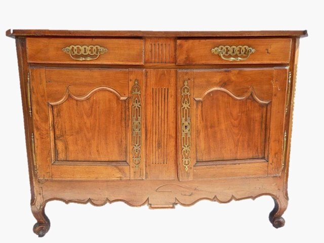 19th C. French Sideboard: Pine construction with moulded top and skirt. Two top drawers over two cabinet doors with French hinges. Brass hardware. 38"H x 53"W x 22"D