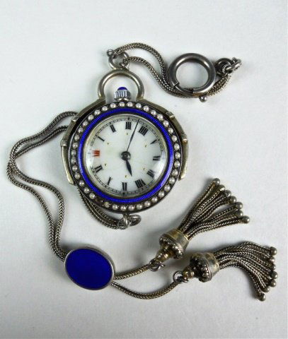 Ladies Silver Guilloche Enamel Pendant Watch: Silver guilloche enamel case with seed pearl border. Reverse carries enamel and gilt star decoration. Roman numeral radial dial with blued indicator hands, gimbaled suspension with silver chain, ename