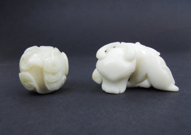 Chinese Jade Figures: Two Chinese jade figures in the form of a pumpkin, having a bat and coins carved in bas-relief, together with a recumbent Ox surmounted by a bat. Each measures approximately 2.25"H Provenance: Private