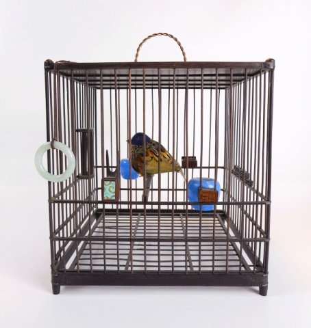 Antique Chinese Birdcage: Having two blue porcelain feeders, white jade ring, and two decorative wooden feeders. 8.25"H x 8"H x 8"D