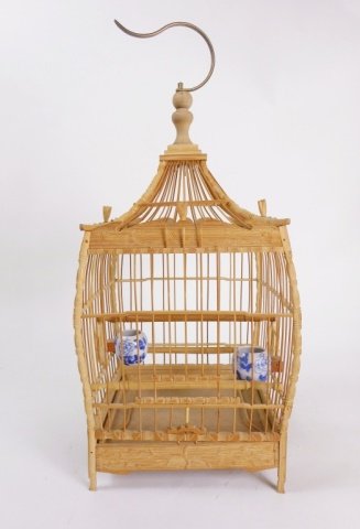Chinese Pagoda Style Birdcage: Having two hand painted blue and white feeders and carved elements in cherry blossom design. 17"H x 6.5"W