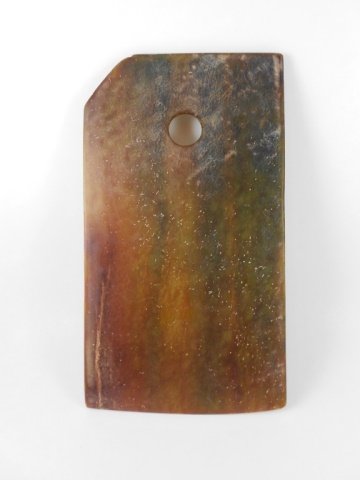 Archaic Chinese Jade Axe: Archaic Chinese jade axe with deep russet and honey toned suffusions, some surface pitting and slight loss at edge. 8.25"H x 4.75"W. Provenance: Private Massachusetts collection.