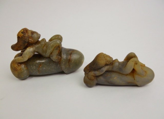 Chinese Jade Fertility Objects: Two antique Chinese jade fertility objects depict female figures laying supine on phalluses measuring 2.25"L and 3"L . Provenance: Private Massachusetts collection.