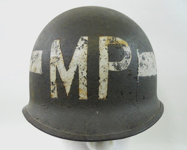 WWII U.S. M1 MP Combat Helmet, Liner with Insignia: Olive drab rough painted surfaces with white hand painted "MP", rear seam swing swivel. Post war liner with stenciled "UP" and second division insignia with unit insignia. Interior oxidation, missing 