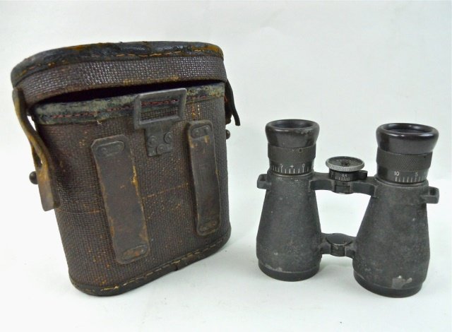 WWI German M08 Field Glasses, Emil Busch: Steel body with textured feldgrau paint with Bakelite eye cups. Center adjustment signed, "Emil Busch A-G Rathenow, Ferngles 08." Case with pressed fiber body with leather trim and riveted leather bel