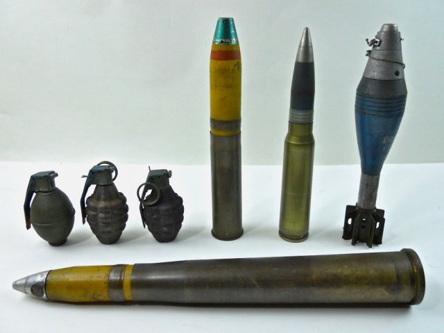 INERT WWII and Vietnam Era Shells, Grenades (7pc): Seven inert shells and grenades of WWII and Vietnam era. First item is a U.S. N40 mm shell stamped on base, "40 MM MK2" with "US GB 3-45." Second item is a US MKII 20 mm shell stamped on base, "2 PB N