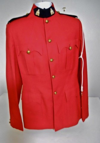 20th C. Canadian RCMP Uniform (3pc): Tunic in red wool construction with five button closure, stand up collar and four pleated pockets. Collar and shoulder boards carry RCMP insignia. White shoulder braid. Blue wool slacks with yellow ve